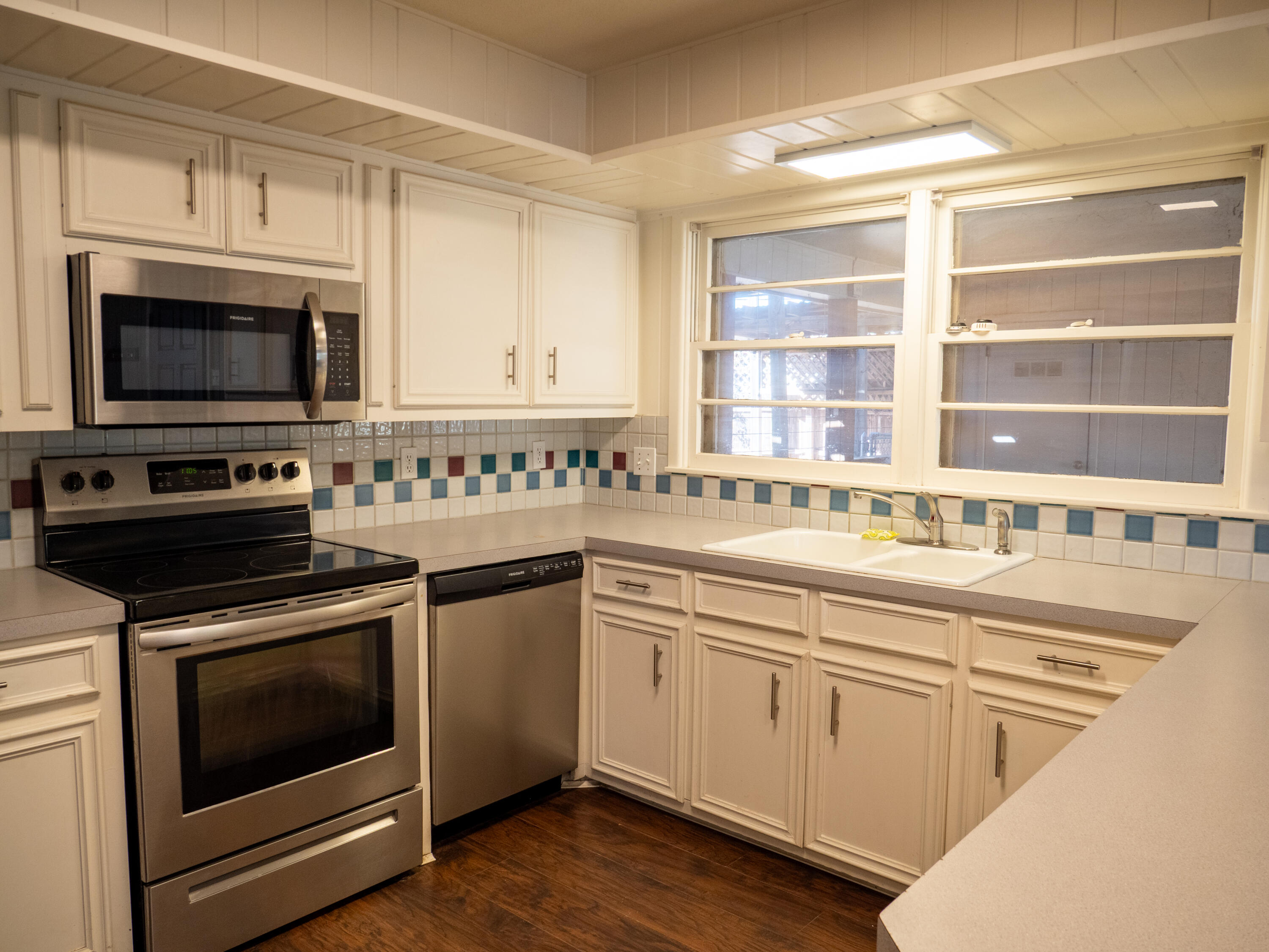 3415 48th Street Lubbock, TX 79413 - Photo 6 of 19 a kitchen with stainless steel appliances granite countertop a stove and a microwave