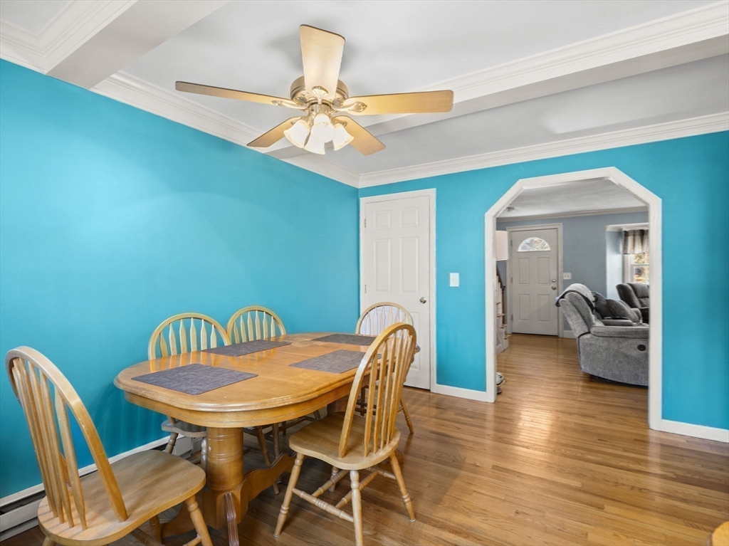 17 Cannongate Road, Unit 87 Tyngsborough, MA 01879 - Photo 14 of 39 a view of a dining room with furniture and wooden floor