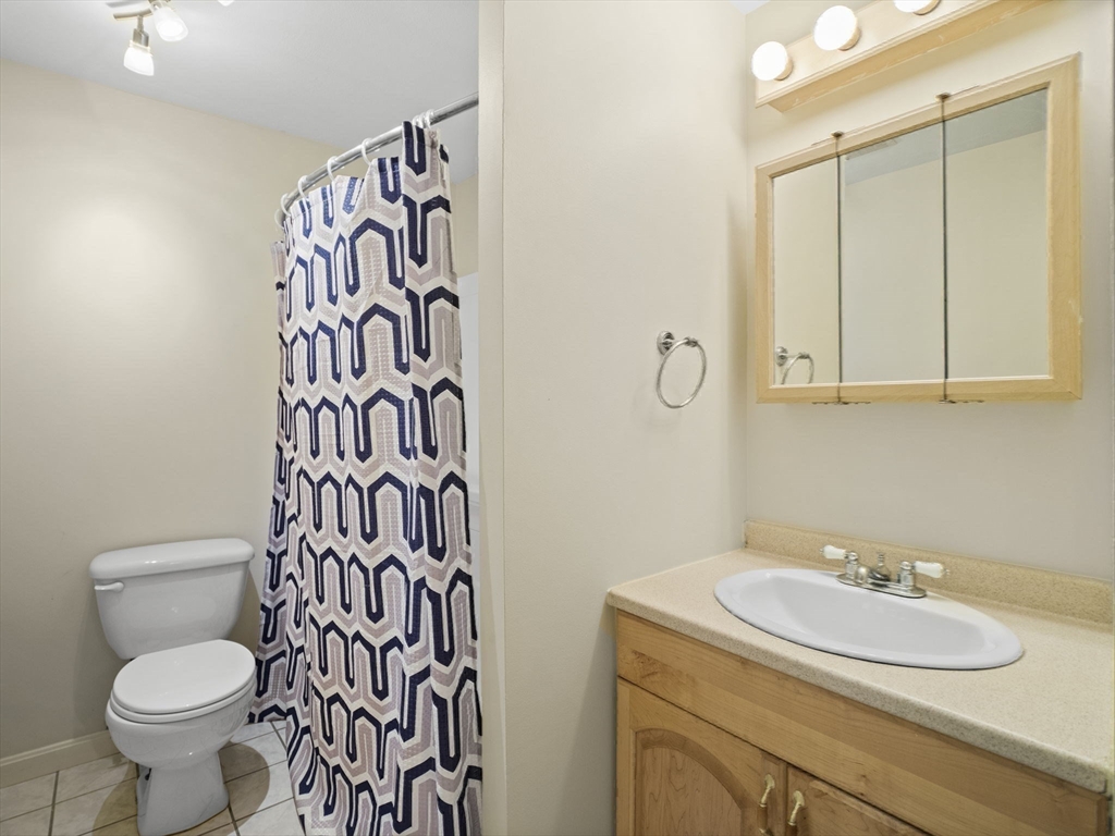 17 Cannongate Road, Unit 87 Tyngsborough, MA 01879 - Photo 18 of 39 a bathroom with a sink and a toilet