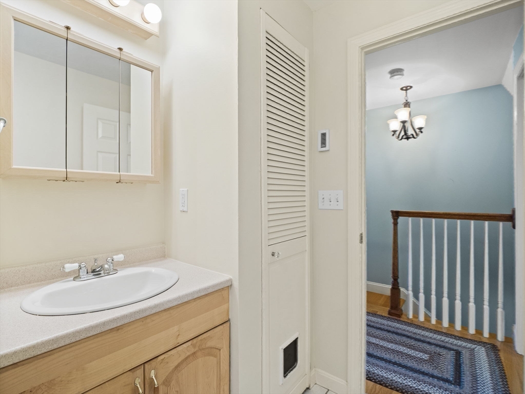 17 Cannongate Road, Unit 87 Tyngsborough, MA 01879 - Photo 19 of 39 a bathroom with a sink and a mirror