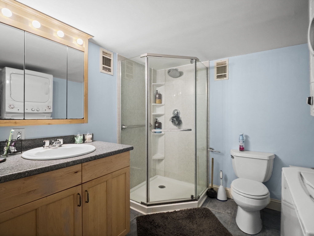 17 Cannongate Road, Unit 87 Tyngsborough, MA 01879 - Photo 24 of 39 a bathroom with a sink a toilet and shower