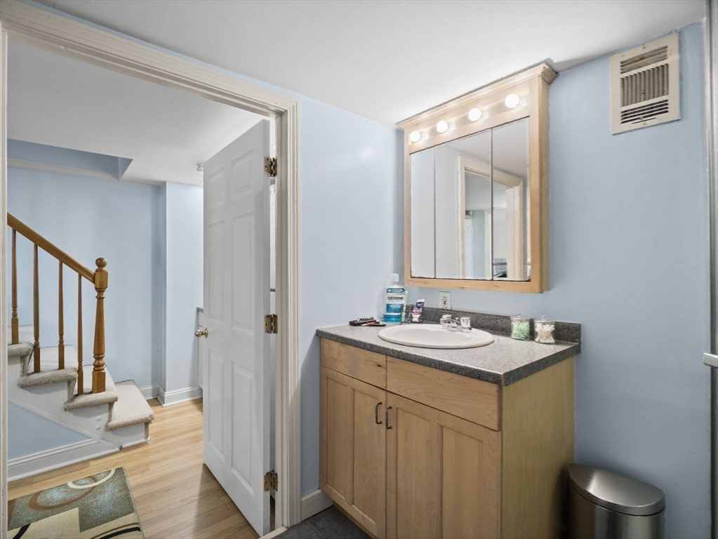17 Cannongate Road, Unit 87 Tyngsborough, MA 01879 - Photo 25 of 39 a bathroom with a sink toilet and shower