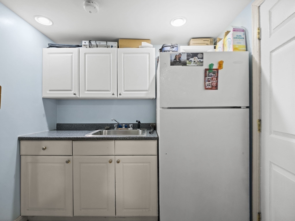 17 Cannongate Road, Unit 87 Tyngsborough, MA 01879 - Photo 26 of 39 a white refrigerator freezer sitting inside of a kitchen