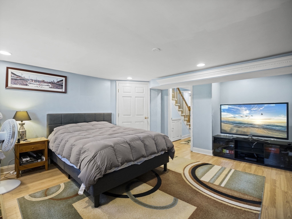 17 Cannongate Road, Unit 87 Tyngsborough, MA 01879 - Photo 27 of 39 a bedroom with a bed and a flat screen tv