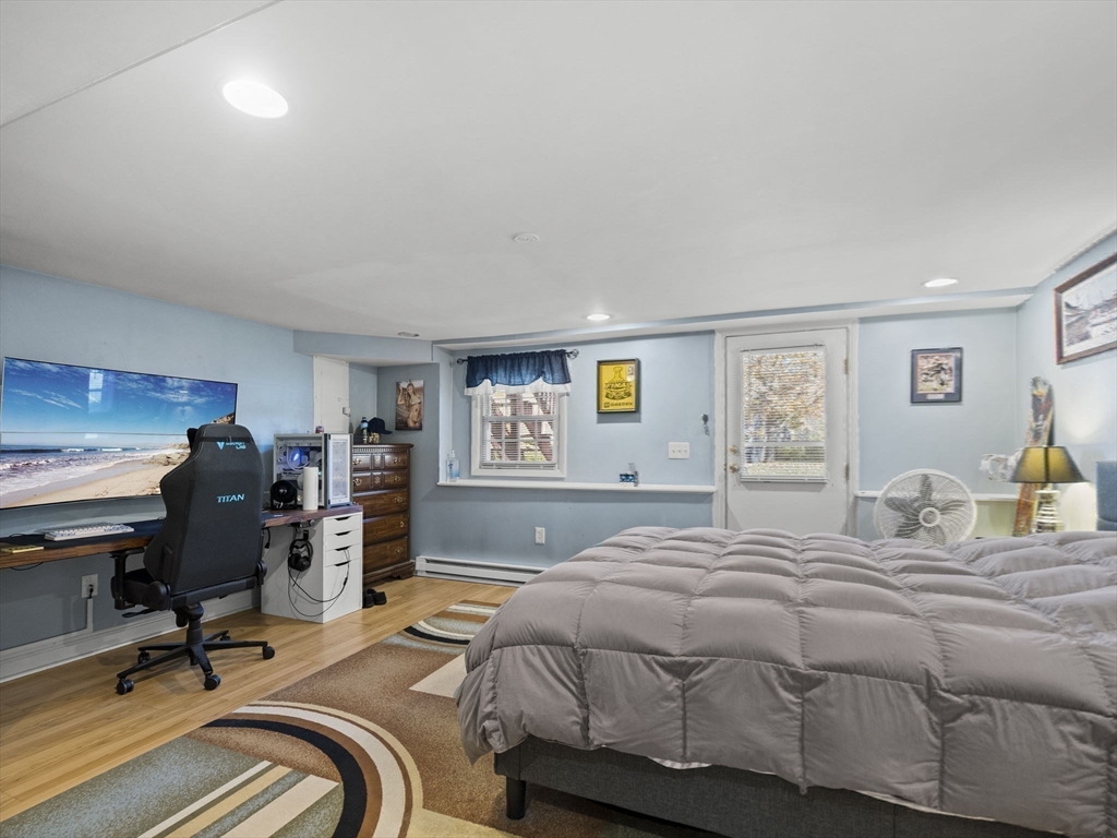 17 Cannongate Road, Unit 87 Tyngsborough, MA 01879 - Photo 30 of 39 a bedroom with a bed and a desk