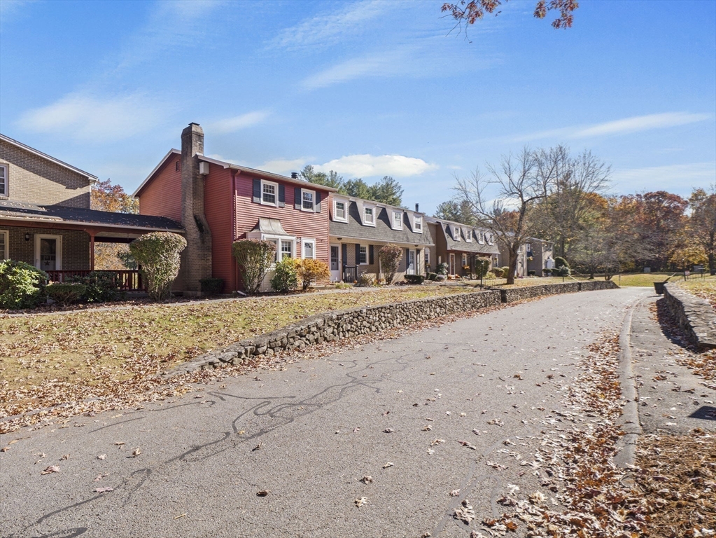 17 Cannongate Road, Unit 87 Tyngsborough, MA 01879 - Photo 36 of 39 a front view of a house with a yard