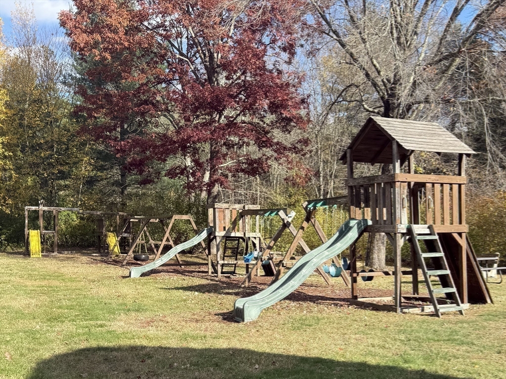 17 Cannongate Road, Unit 87 Tyngsborough, MA 01879 - Photo 38 of 39 a view of a house with large trees and a park