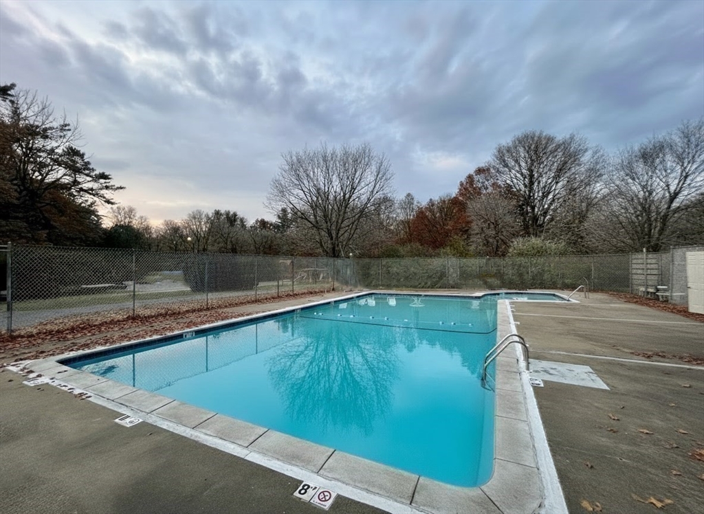 17 Cannongate Road, Unit 87 Tyngsborough, MA 01879 - Photo 39 of 39 a view of a swimming pool with a yard