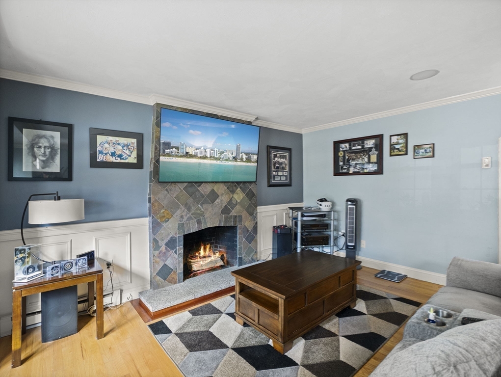 17 Cannongate Road, Unit 87 Tyngsborough, MA 01879 - Photo 4 of 39 a living room with furniture and a fireplace