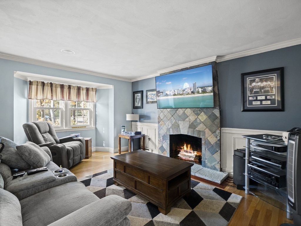 17 Cannongate Road, Unit 87 Tyngsborough, MA 01879 - Photo 6 of 39 a living room with furniture and a fireplace