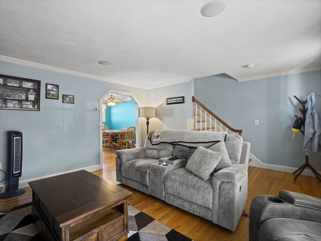17 Cannongate Road, Unit 87 Tyngsborough, MA 01879 - Photo 7 of 39 a living room with furniture and a wooden floor