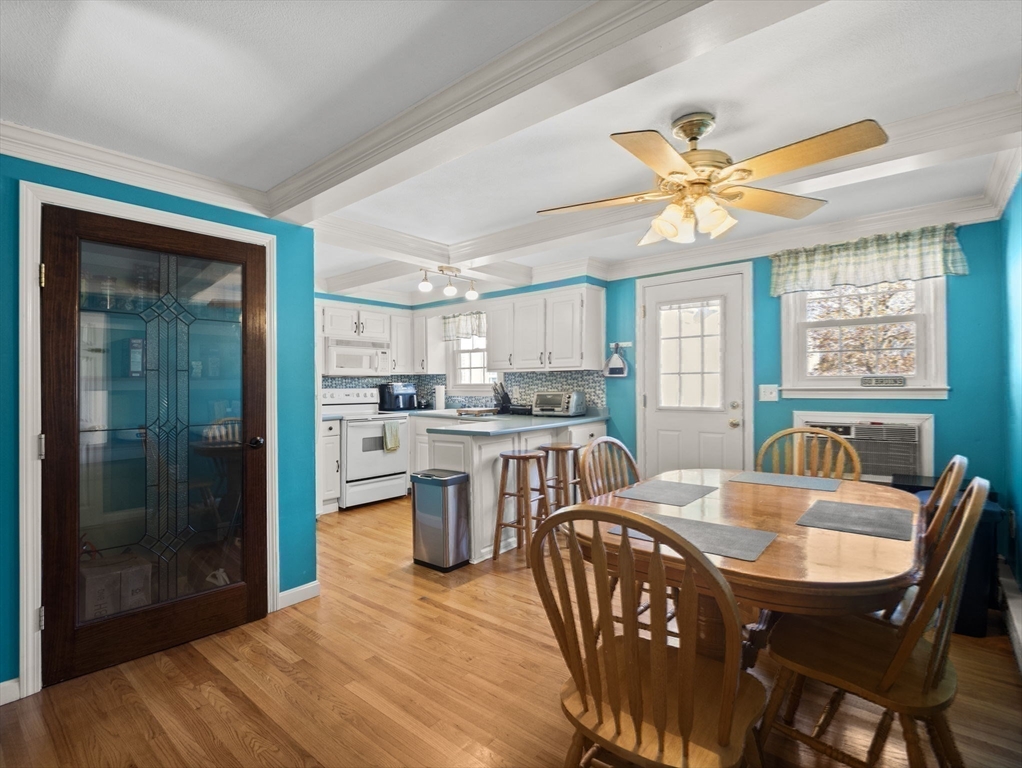 17 Cannongate Road, Unit 87 Tyngsborough, MA 01879 - Photo 8 of 39 a view of a dining room with furniture window and outside view