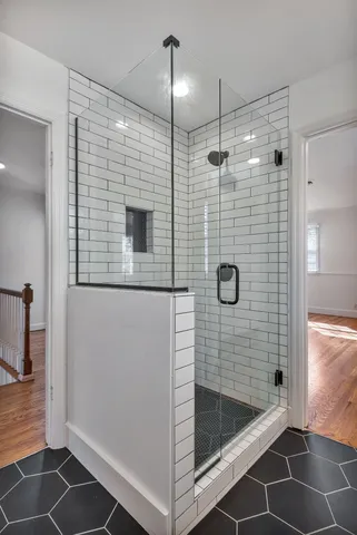a bathroom with a shower and a sink