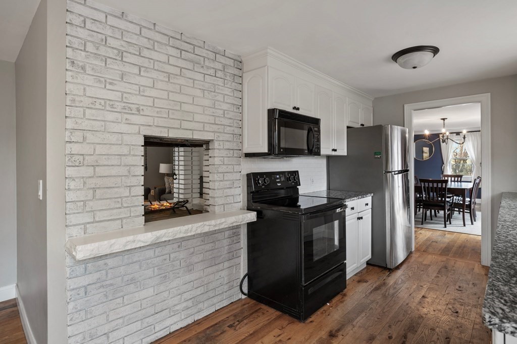 268 Forest Hills Road Springfield, MA 01128 - Photo 14 of 42 a kitchen with a refrigerator and a stove top oven