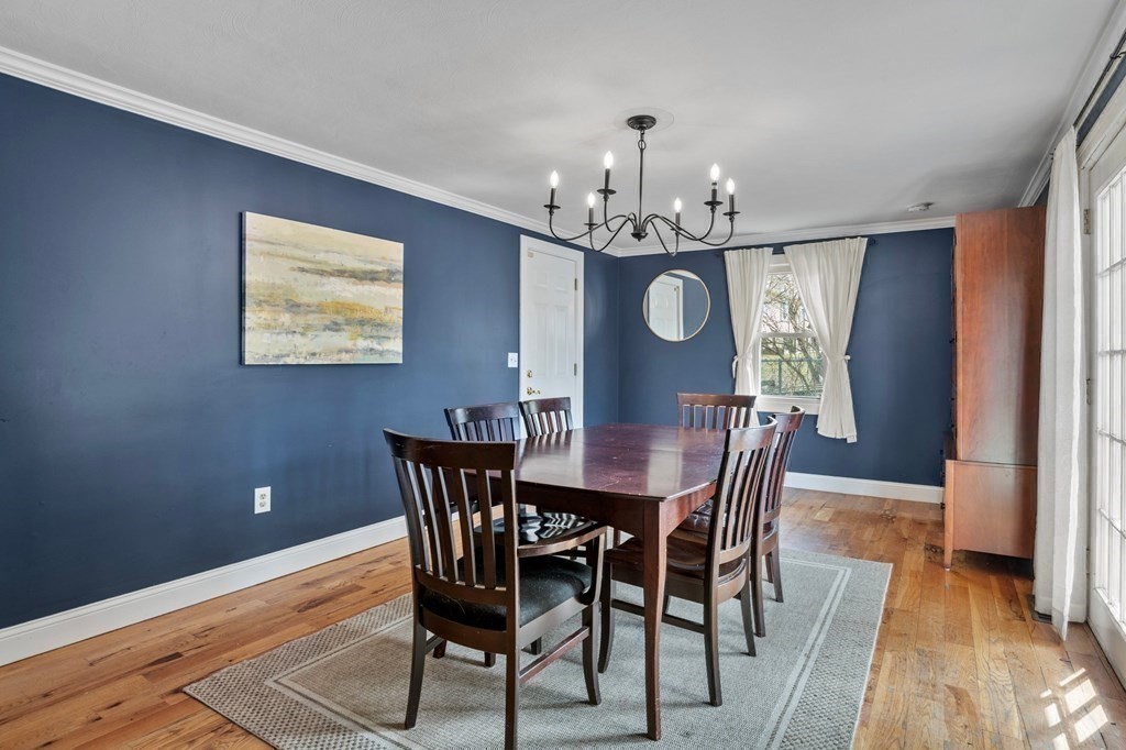 268 Forest Hills Road Springfield, MA 01128 - Photo 23 of 42 a view of a dining room with furniture a chandelier and wooden floor