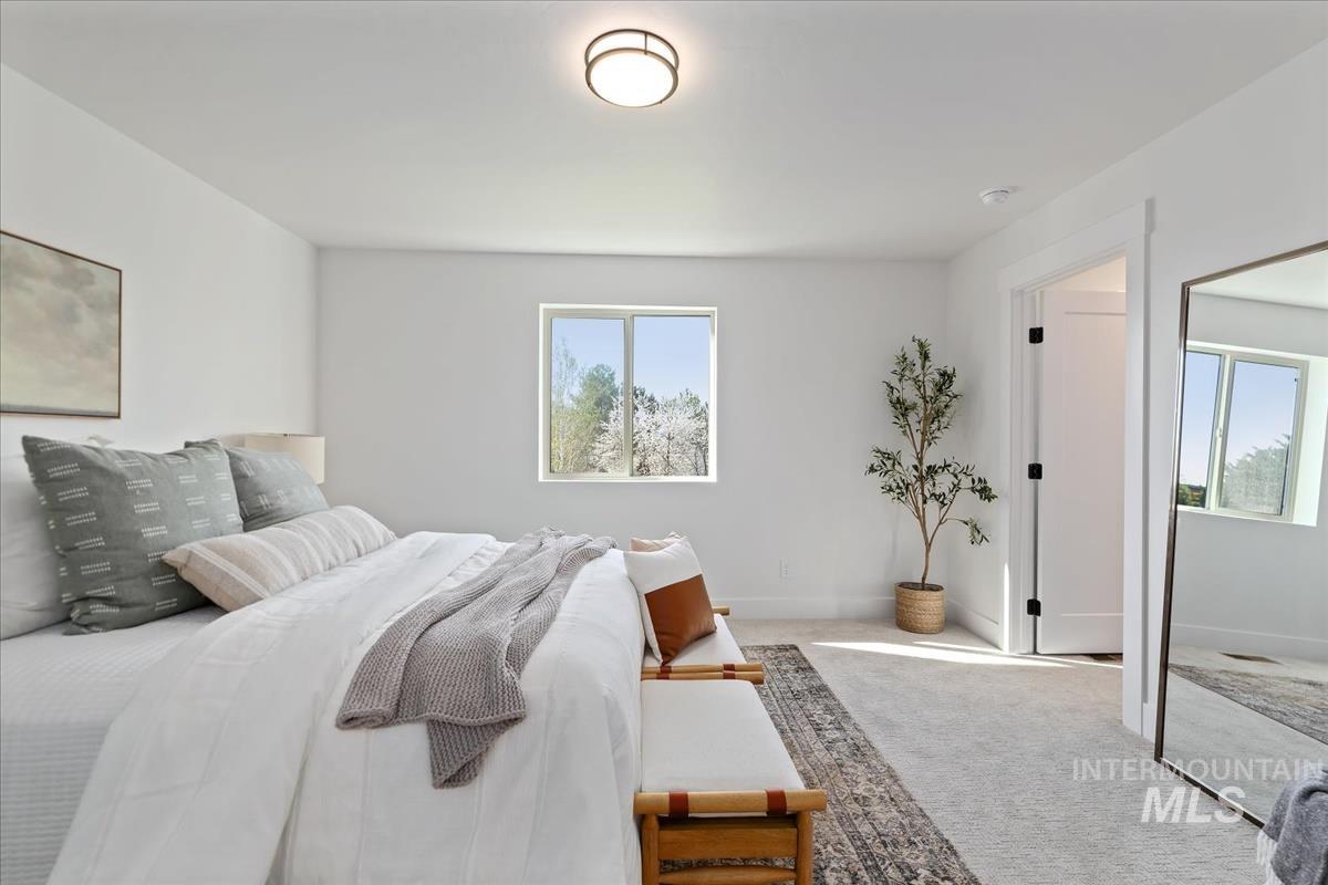 1725 South Rock View Lane, Unit 34 Boise, ID 83705 - Photo 14 of 31 Carpeted bedroom featuring baseboards