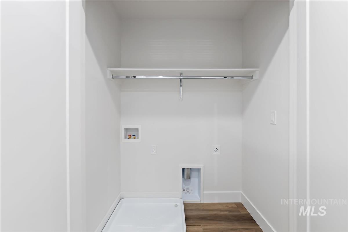 1725 South Rock View Lane, Unit 34 Boise, ID 83705 - Photo 27 of 31 Laundry room featuring hookup for a washing machine, hookup for an electric dryer, and wood finished floors