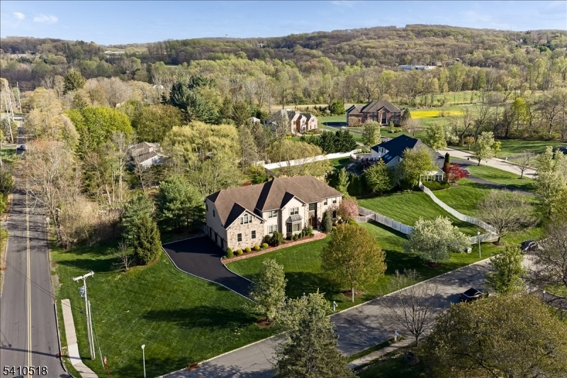 1 Brodziak Road Denville, NJ 07834 - Photo 39 of 42 an aerial view of a house with a garden and trees