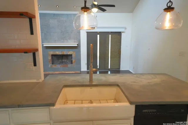 a bathroom with a tub sink and mirror