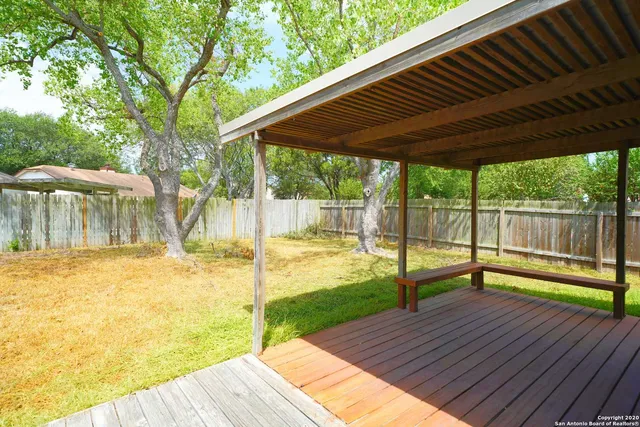 a view of a backyard with a patio