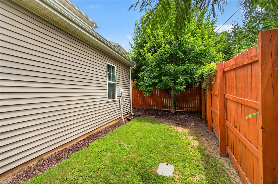 235 Pendleton Road, Unit K1 Clemson, SC 29631 - Photo 6 of 49 A well-maintained side yard with secure fencing offers a tranquil green space.
