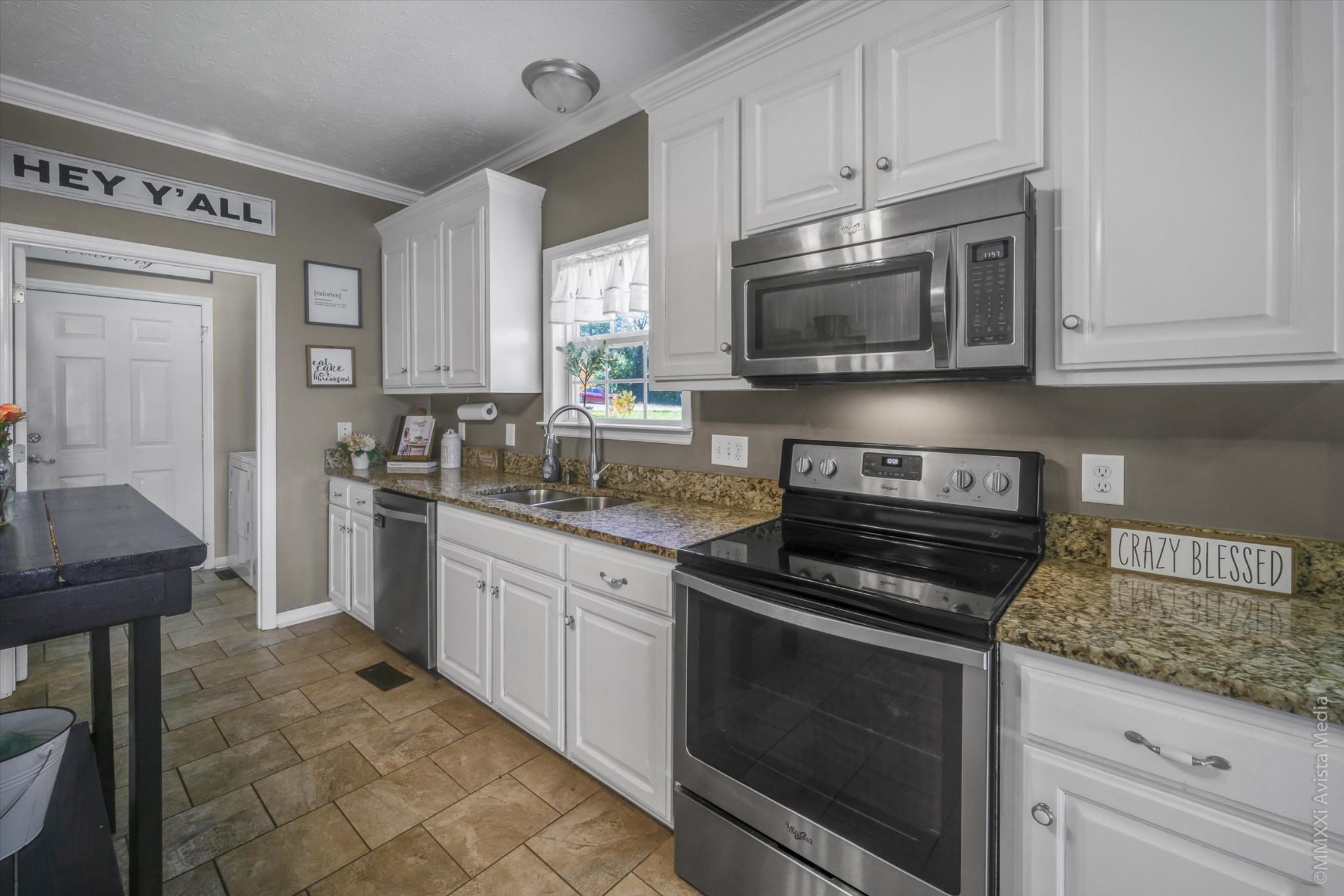 14908 Mt Pleasant Road Rockvale, TN 37153 - Photo 11 of 33 a kitchen with granite countertop a stove sink and microwave