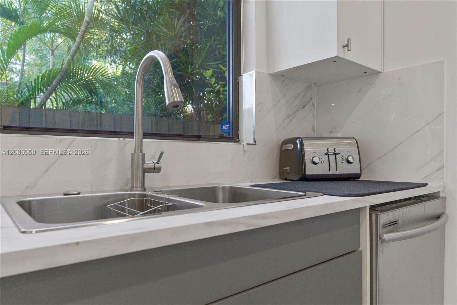 2889 Southwest 33rd Avenue, Unit 2889 Miami, FL 33133 - Photo 13 of 38 a close view of sink and tap