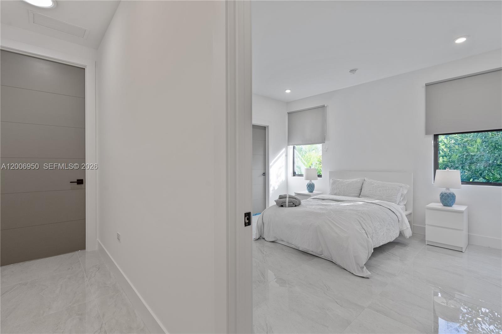 2889 Southwest 33rd Avenue, Unit 2889 Miami, FL 33133 - Photo 25 of 38 a bedroom with a bed and window