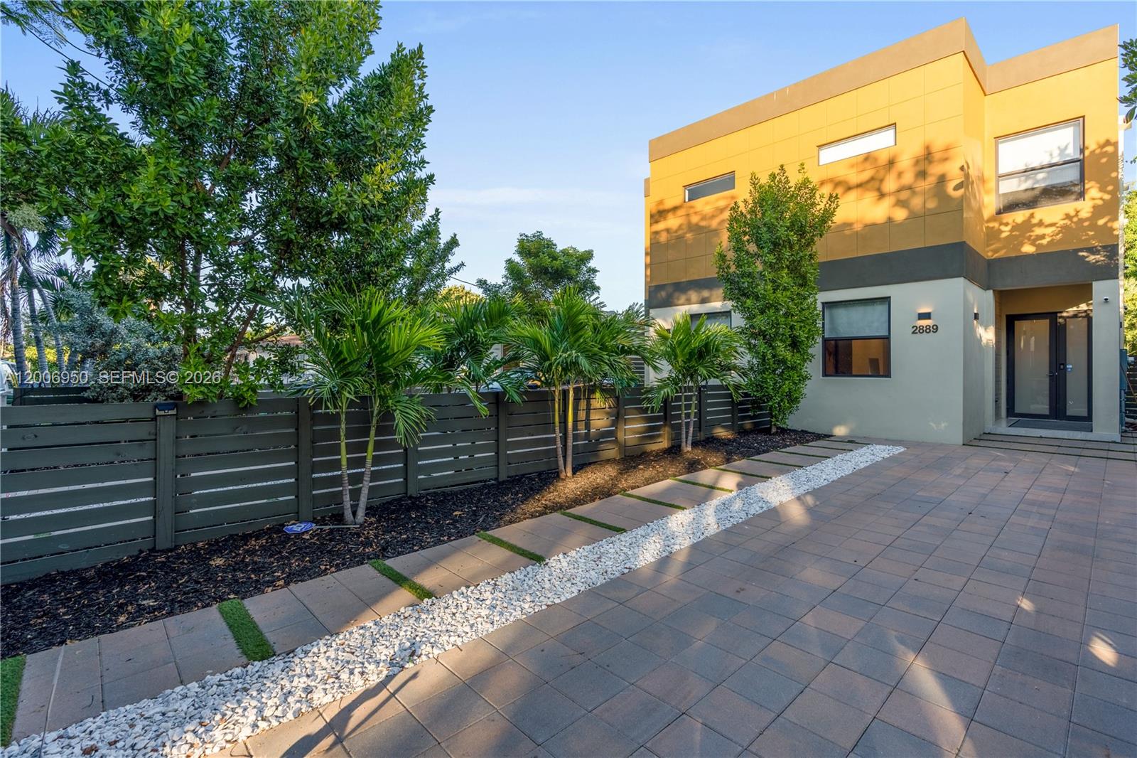 2889 Southwest 33rd Avenue, Unit 2889 Miami, FL 33133 - Photo 37 of 38 a view of a backyard with a patio