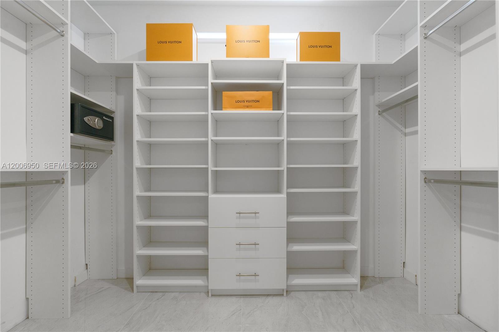 2889 Southwest 33rd Avenue, Unit 2889 Miami, FL 33133 - Photo 4 of 38 a view of walk in closet with empty racks