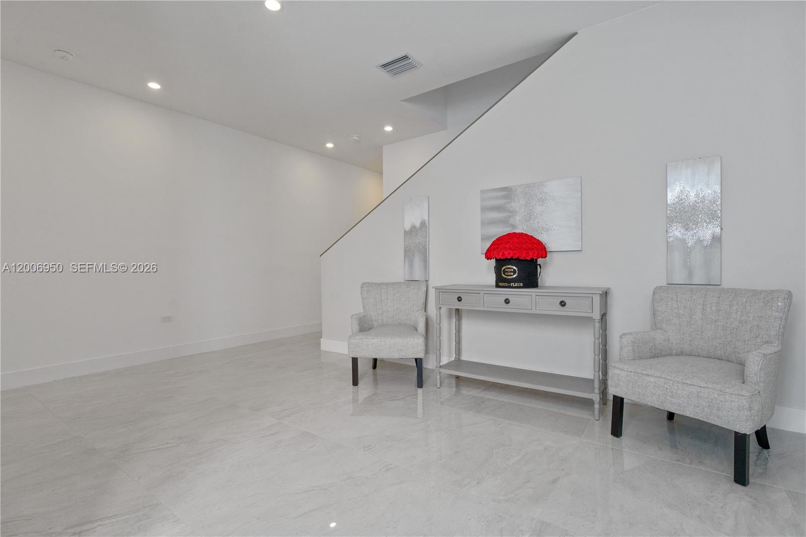 2889 Southwest 33rd Avenue, Unit 2889 Miami, FL 33133 - Photo 8 of 38 a living room with furniture and a ceiling fan