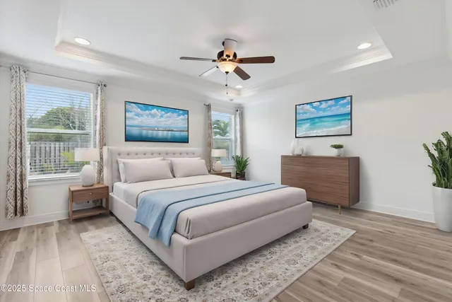 a living room with a bed furniture and a window