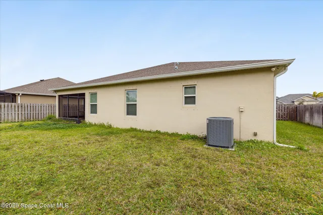 a house view with a backyard space