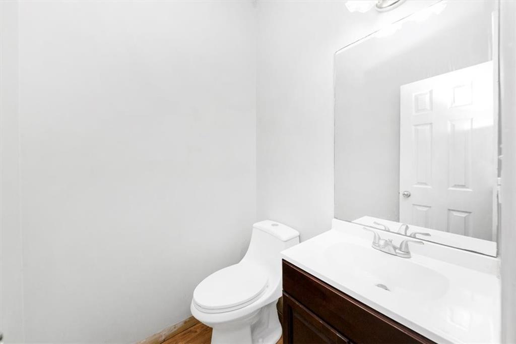 244 Freestone Lane Dallas, GA 30132 - Photo 14 of 26 a bathroom with a sink a toilet and mirror