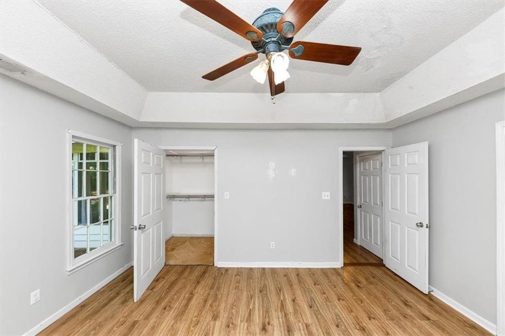 244 Freestone Lane Dallas, GA 30132 - Photo 16 of 26 wooden floor in an empty room with a window