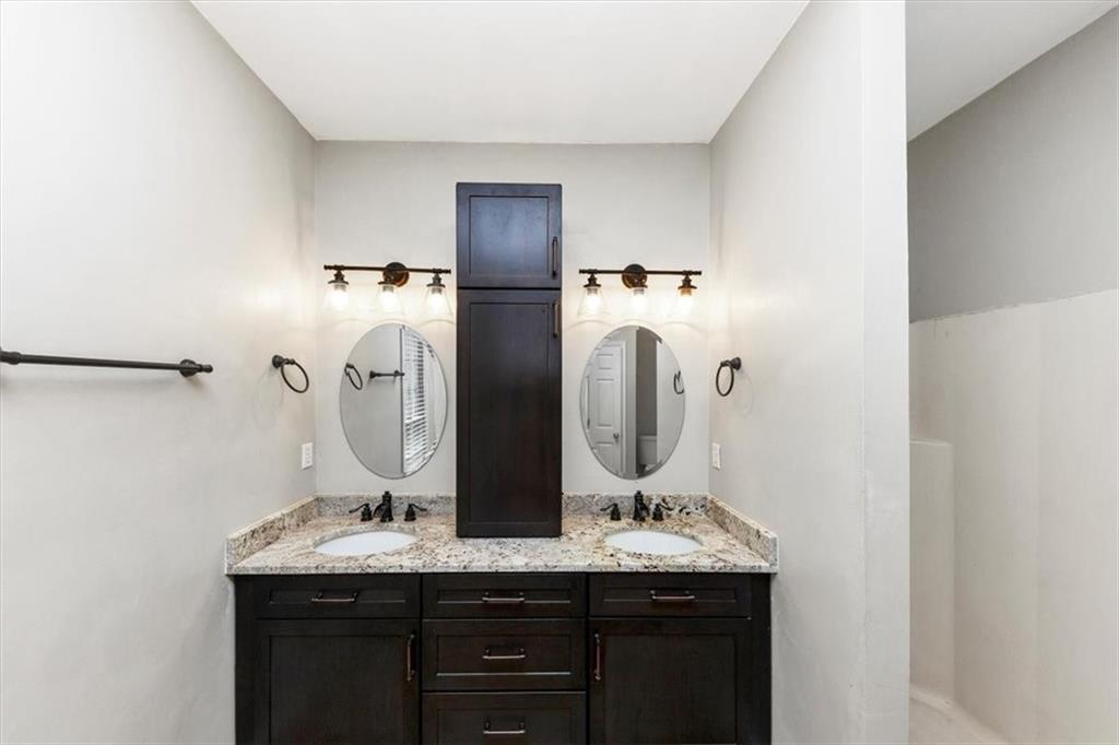 244 Freestone Lane Dallas, GA 30132 - Photo 19 of 26 a bathroom with double vanity sink and mirror