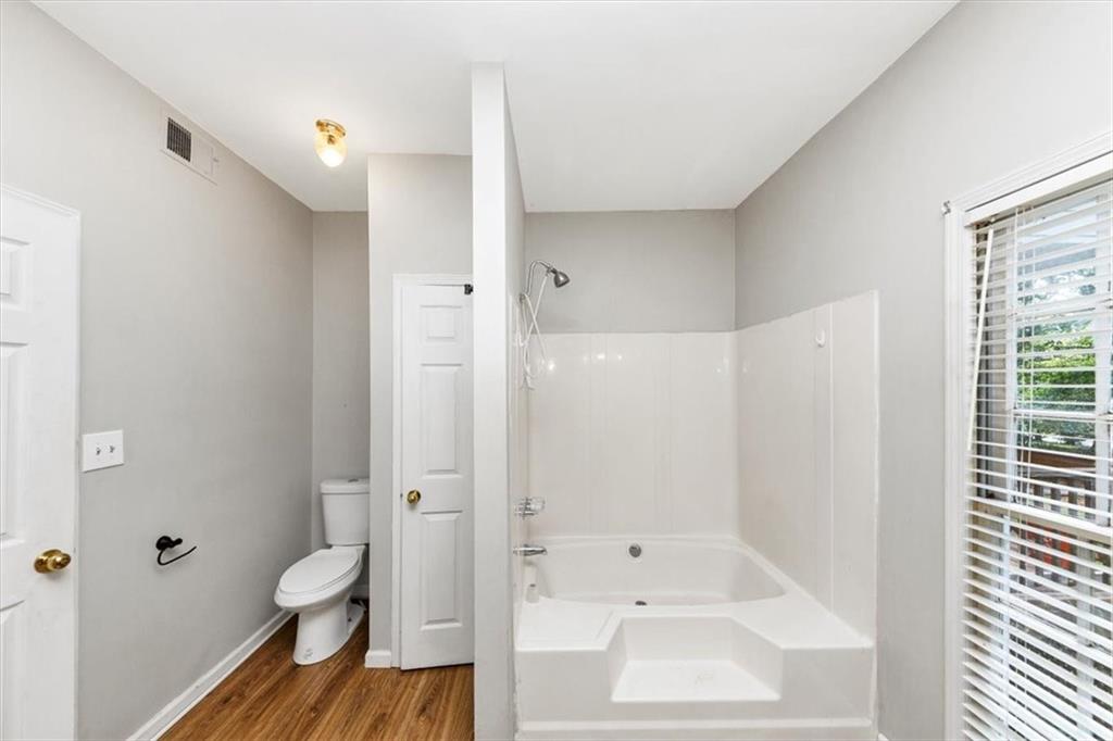 244 Freestone Lane Dallas, GA 30132 - Photo 20 of 26 a bathroom with a shower and a toilet