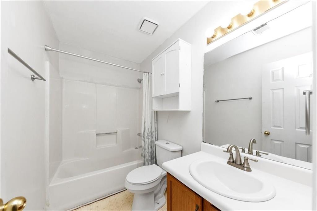 244 Freestone Lane Dallas, GA 30132 - Photo 22 of 26 a bathroom with a sink toilet and shower