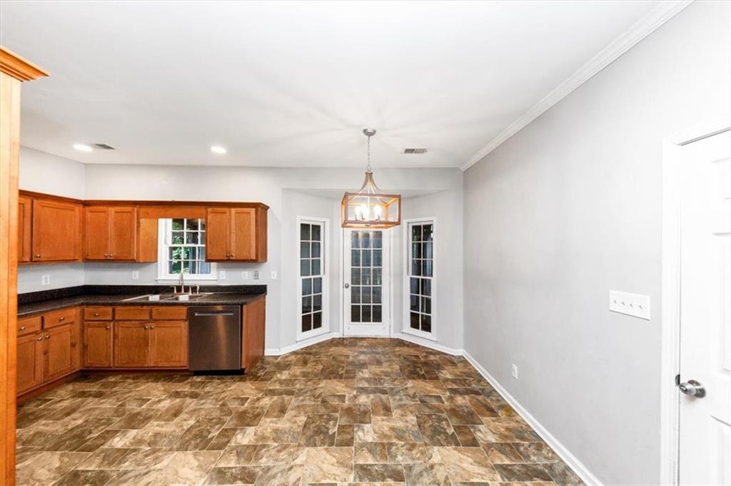 244 Freestone Lane Dallas, GA 30132 - Photo 7 of 26 a view of kitchen with granite countertop cabinets and stainless steel appliances