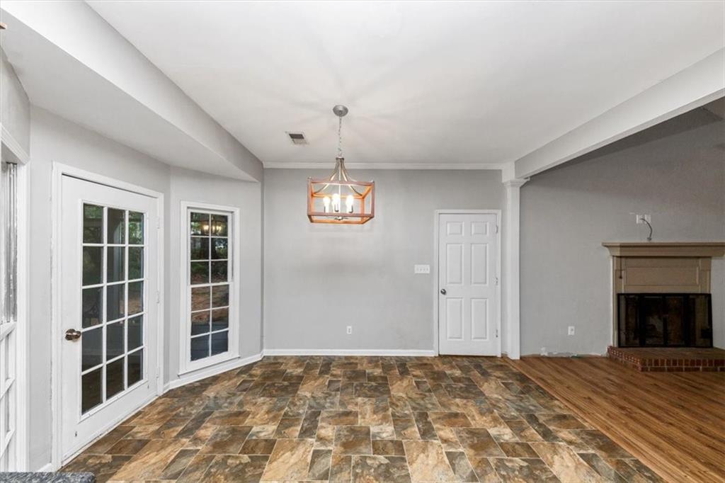 244 Freestone Lane Dallas, GA 30132 - Photo 8 of 26 a view of an empty room with a window and fireplace