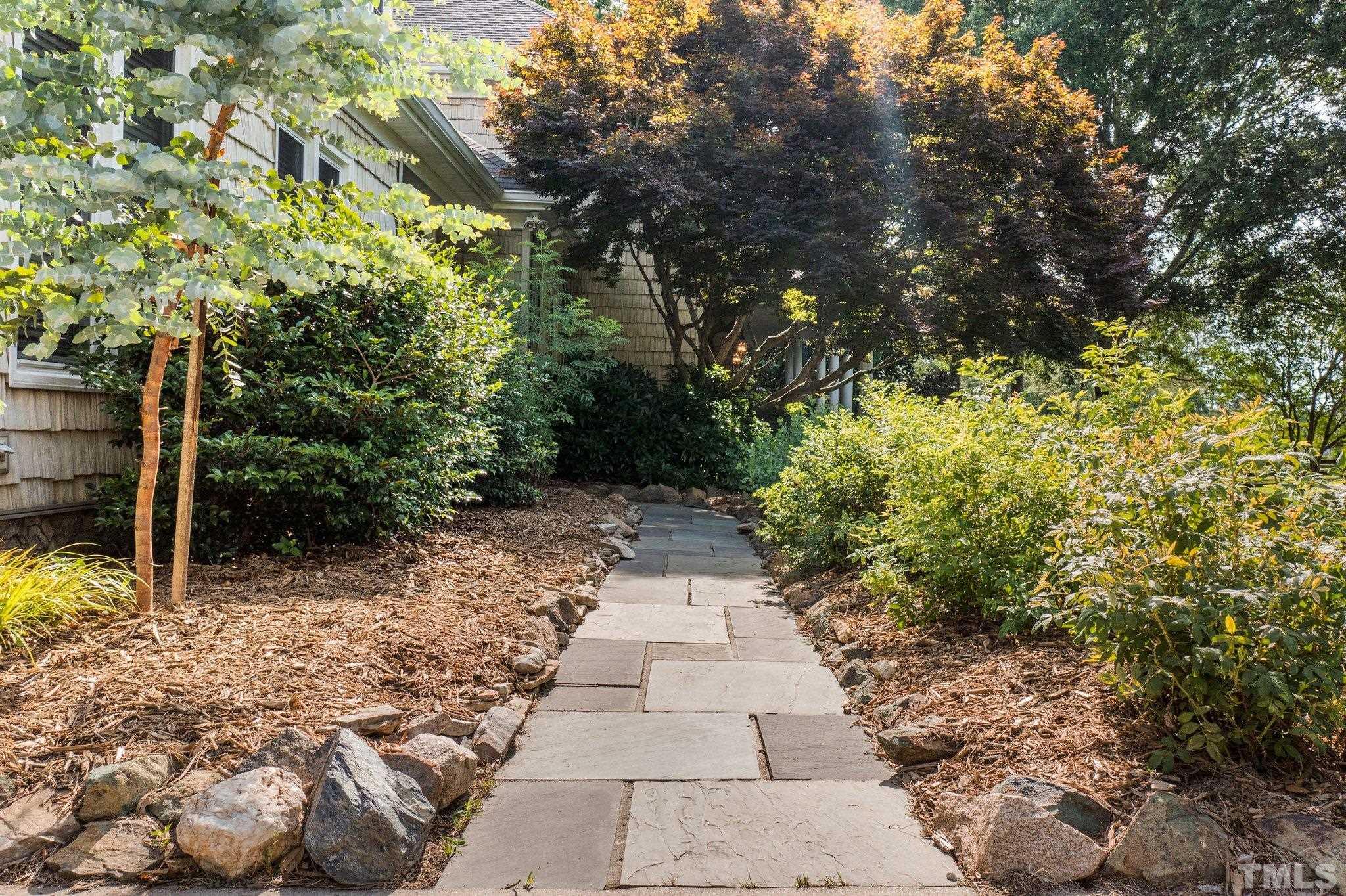 8737 Castleberry Road Apex, NC 27523 - Photo 25 of 99 a backyard of a house with lots of green space