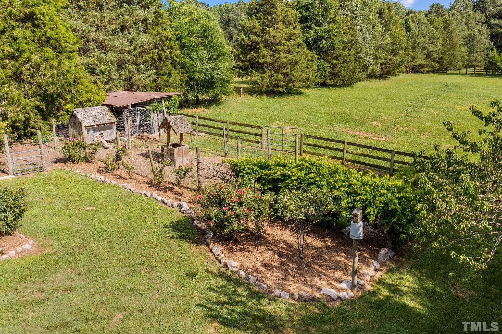 8737 Castleberry Road Apex, NC 27523 - Photo 27 of 99 a view of a yard with an outdoor space