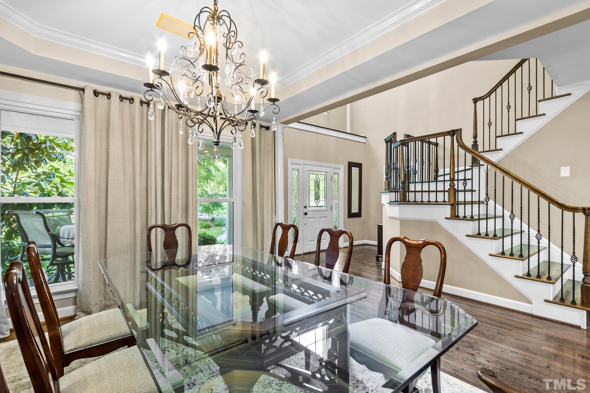 8737 Castleberry Road Apex, NC 27523 - Photo 30 of 99 a view of a dining room with furniture window and outside view