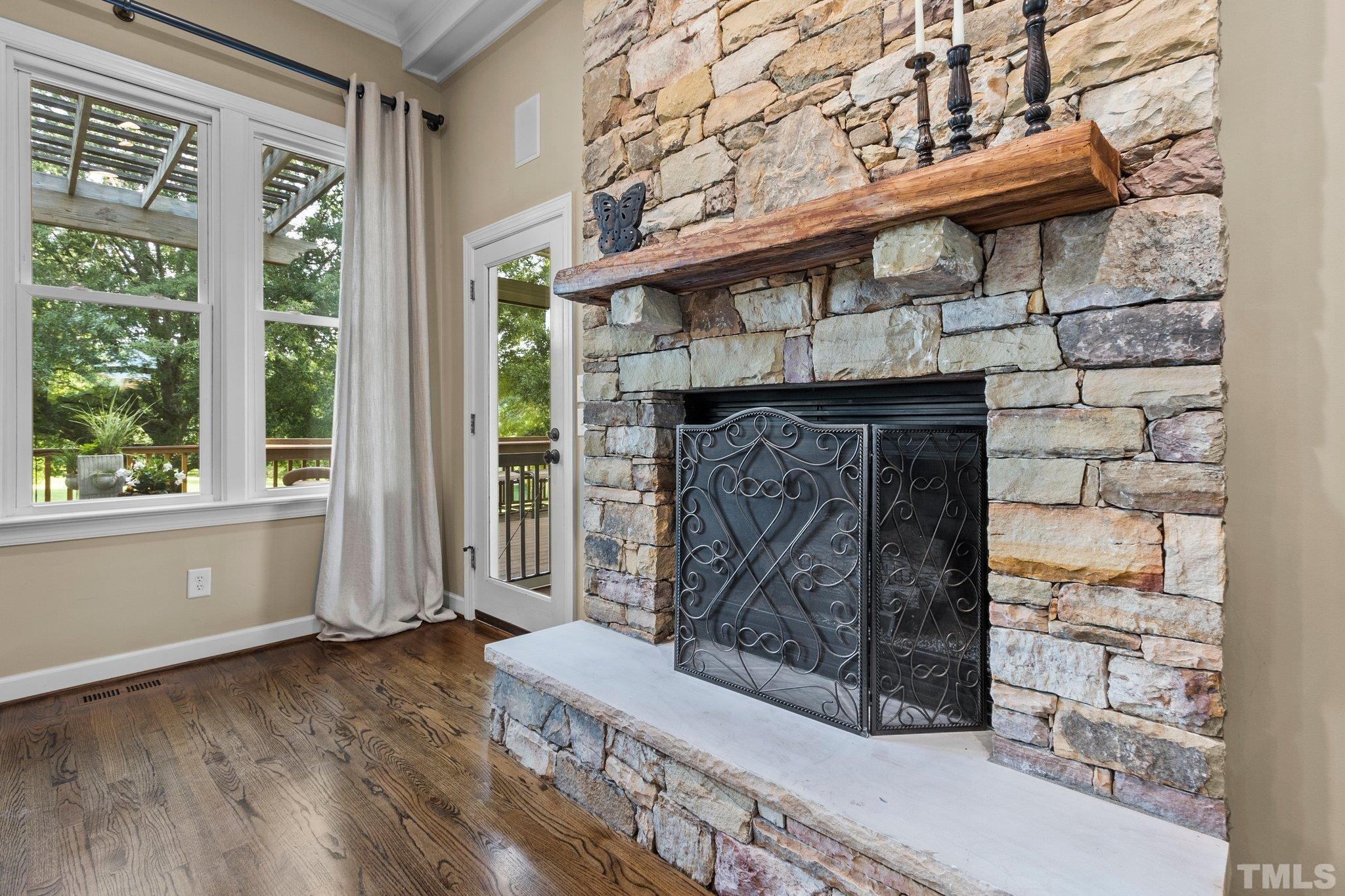 8737 Castleberry Road Apex, NC 27523 - Photo 43 of 99 a view of fireplace and window in an empty room