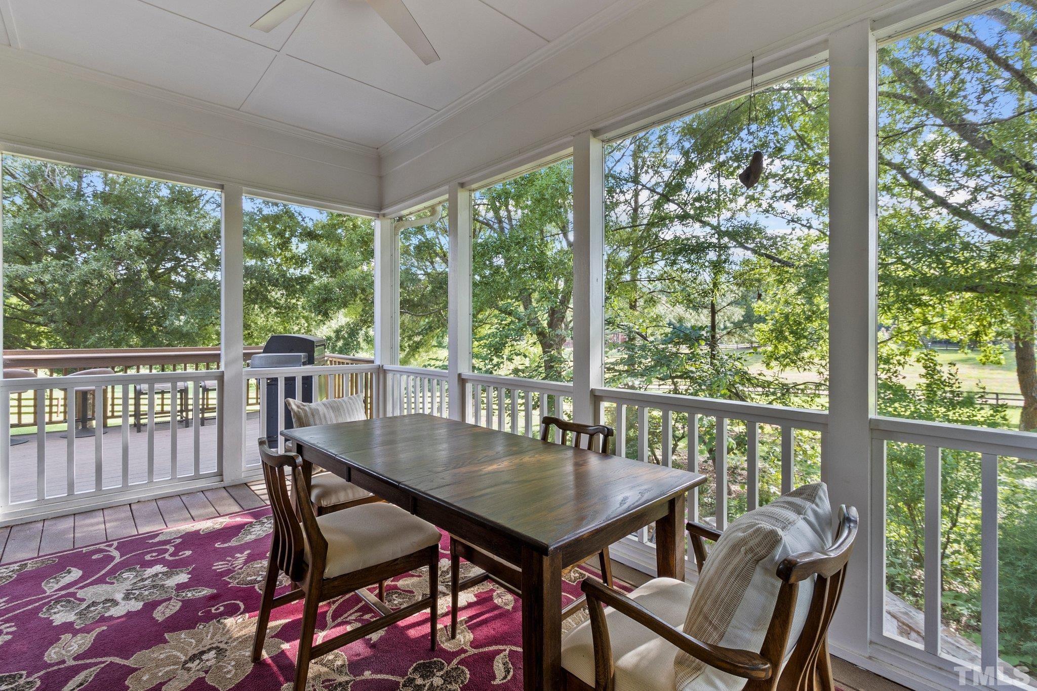 8737 Castleberry Road Apex, NC 27523 - Photo 45 of 99 a view of a dining room with furniture and window