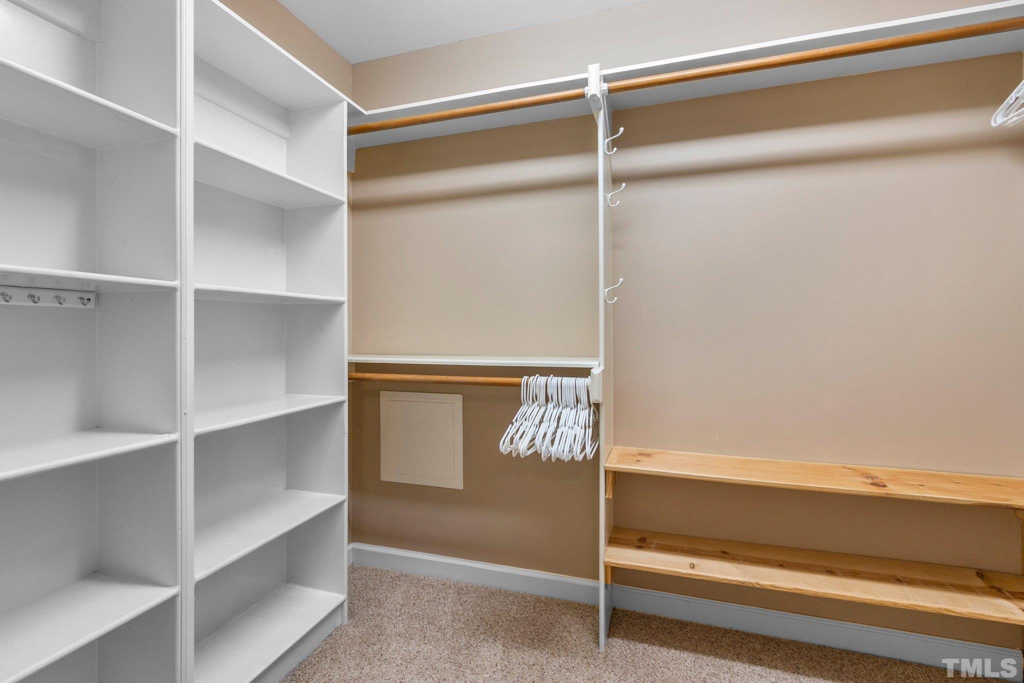 8737 Castleberry Road Apex, NC 27523 - Photo 59 of 99 a view of walk in closet with empty racks