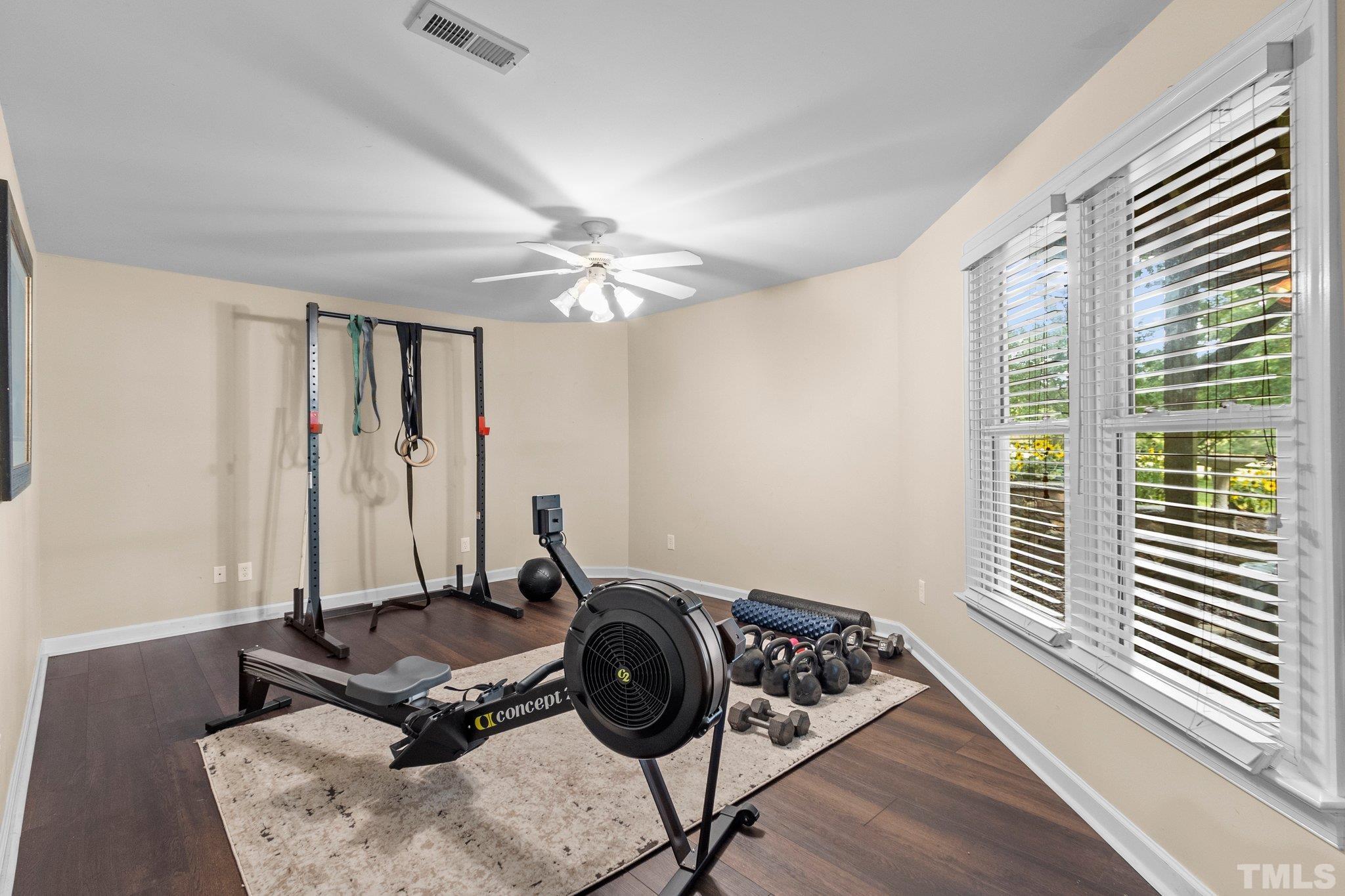 8737 Castleberry Road Apex, NC 27523 - Photo 69 of 99 a view of a workspace with furniture and a window