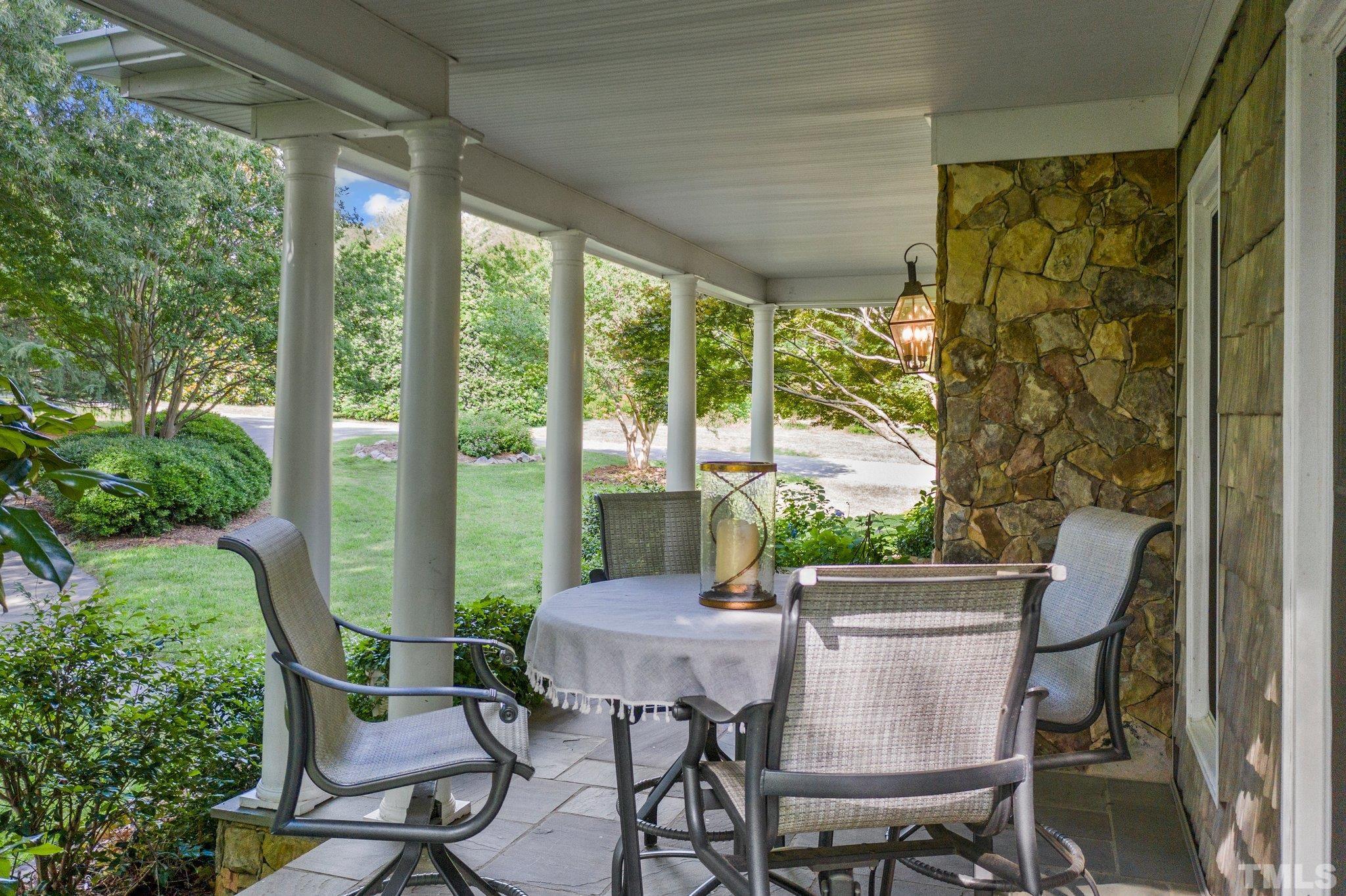 8737 Castleberry Road Apex, NC 27523 - Photo 7 of 99 a view of a patio with table and chairs