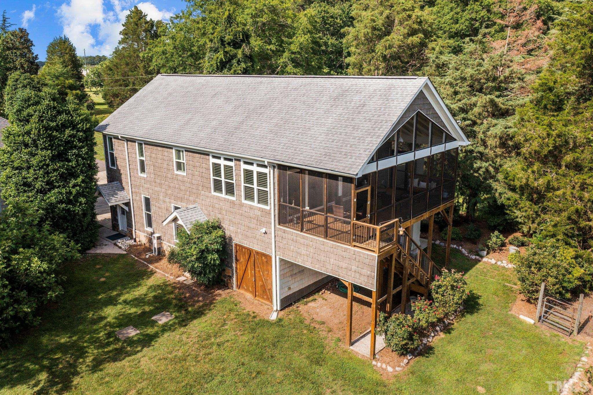 8737 Castleberry Road Apex, NC 27523 - Photo 95 of 99 an aerial view of a house with yard porch and sitting area