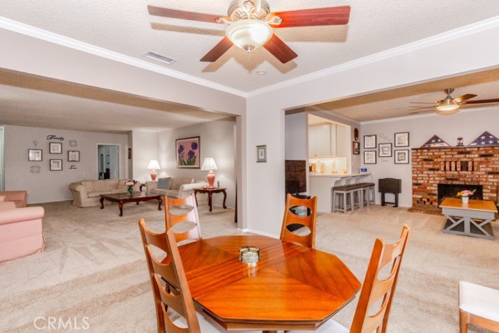 11229 Elmhurst Drive Norwalk, CA 90650 - Photo 11 of 54 a living room with furniture a table and chairs
